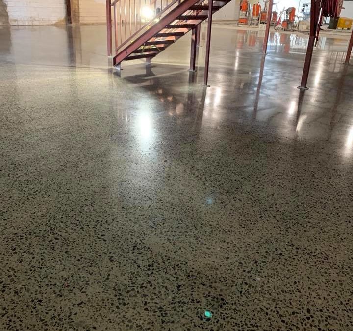 Polishing concrete floors in large commercial spaces is practical and cost effective. With modern remote controlled machines, it is possible to deliver a high end floor treatment that enhances a showroom. In addition, it provides a very serviceable long life option requiring minimal ongoing maintenance.