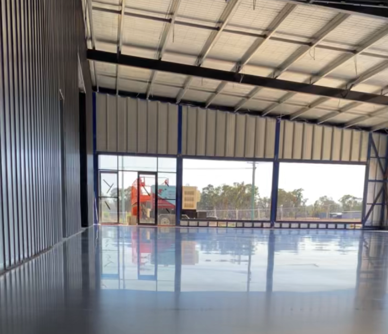 Industrial showroom underwent 75% aggregate stone exposure